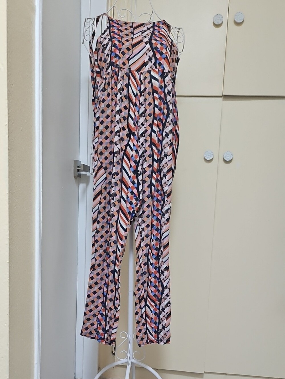The Odells Med Geometric Print Jumpsuit in Pink, Org and Navy.